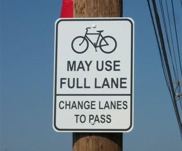 Cyclists may use full lane sign in Ferguson (CC licensed by MoBikeFed via Flickr).jpg