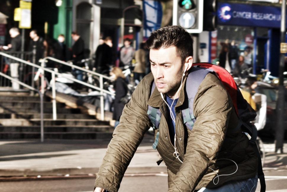 Cyclist with earphones - Copyright Simon MacMichael