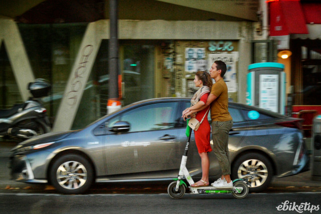 Lime e-scooter riders in Paris 02 (copyright Simon MacMichael).jpeg
