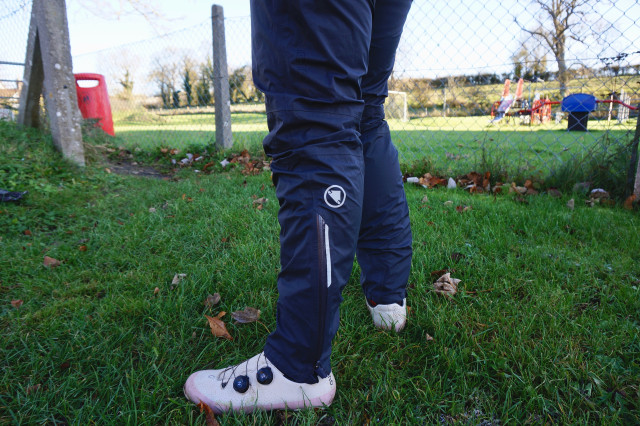 2023 Endura GV500 Waterproof Trousers Zipped up & reflective logo.jpeg