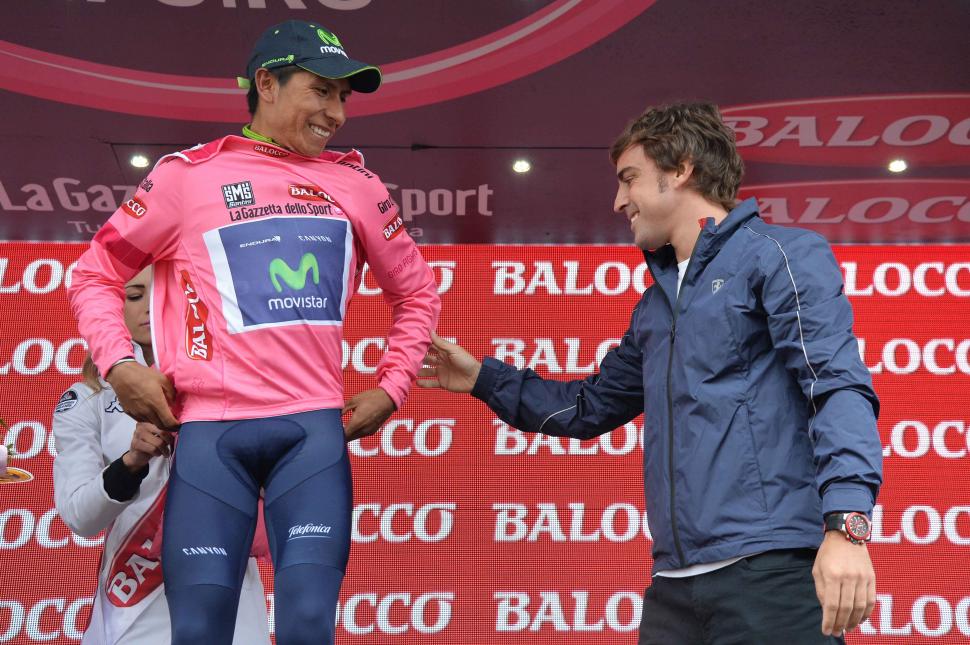 Fernando Alonso presents Nairo Quintana with maglia rosa at S18 of 2014 Giro (pic credit Gian Mattia d'Alberto, LaPresse)