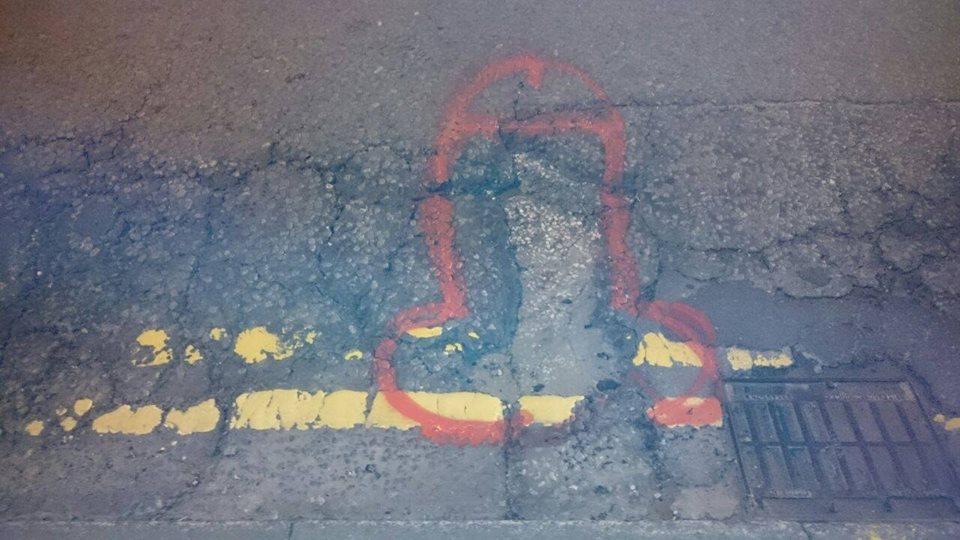 Pothole penis graffiti (source Wanksy Facebook page)